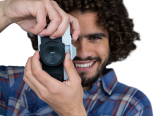 Portrait of smiling photographer taking picture