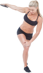 Fototapeta premium Sportswoman holding discus while standing