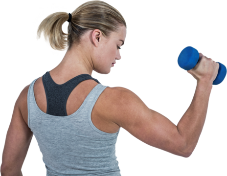 Muscular woman working out with dumbbells