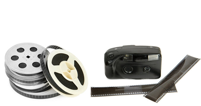 Old camera, film and Film reel isolated on white . Collage. Free space for text. Wide photo.