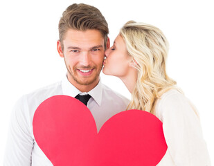 Attractive young couple holding red heart