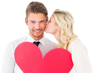 Attractive young couple holding red heart