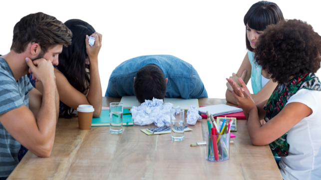 Exhausted creative business team in meeting 