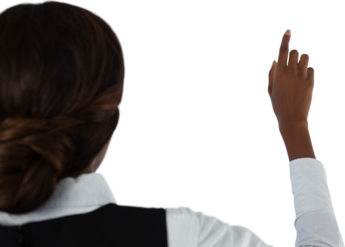 Rear view of businesswoman touching invisible screen - Powered by Adobe