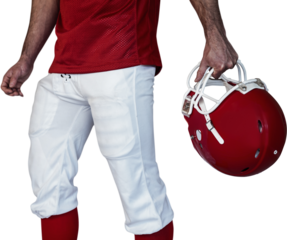 Midsection of player holding rugby helmet