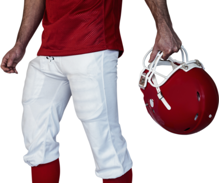 Midsection of player holding rugby helmet - Powered by Adobe