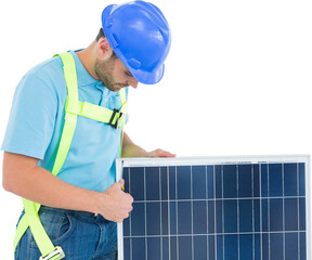 Construction worker examining solar panel
