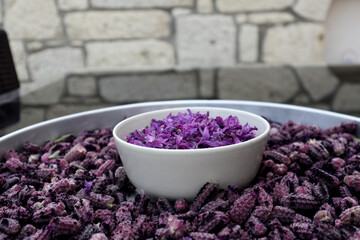 Obraz na płótnie Canvas In Turkey harvested flowers of crested lavender (Herba Lavanduala stoechas) ready for further processing. The purple-colored bracts are cooked into jam, the flowers are dried as tea