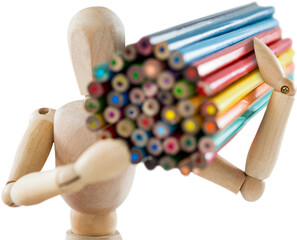 Wooden figurine carrying bunch of colorful pencils
