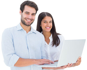 Attractive young couple holding their laptop