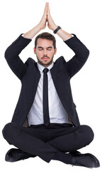 Businessman sitting in lotus pose with hands together