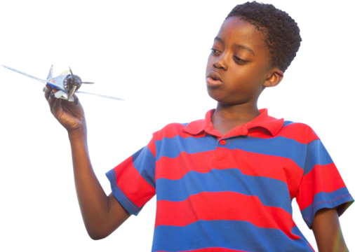 Little boy playing with toy airplane