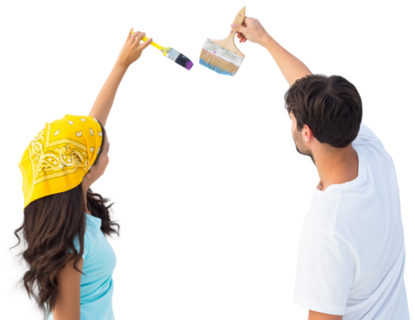 Happy young couple painting together