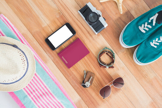 Accessories and travel items on wooden board