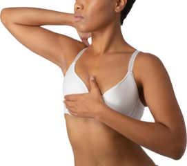 Woman standing for breast cancer awareness against white background