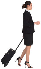 Businesswoman pulling her suitcase