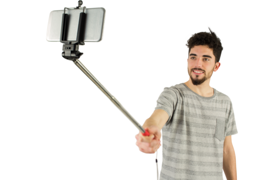 Casual man using a selfie stick