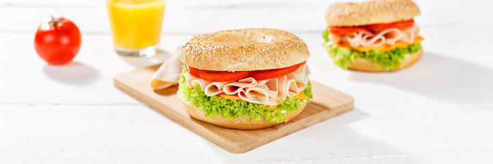 Bagel sandwich with chicken ham for breakfast panorama