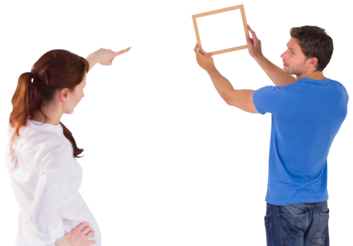 Couple deciding to hang picture