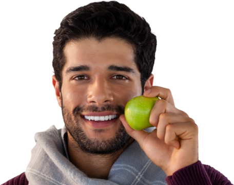 Close-up portrait of smiling man holding apple