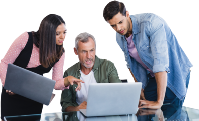 Business people discussing over laptop