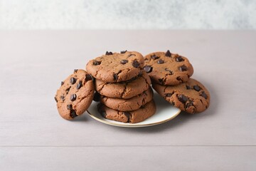 chocolate chip cookies, chocolate chip cookies on wooden table, chocolate chip cookies on a pink plate on a white wooden table