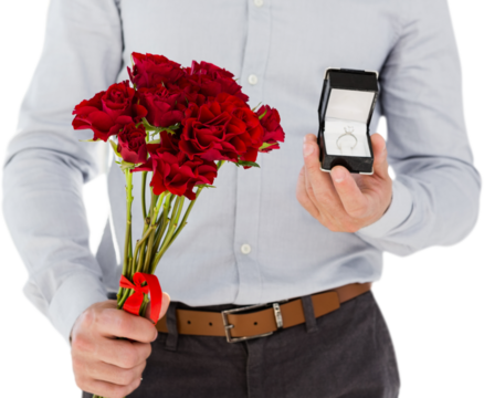Man holding engagement ring and roses