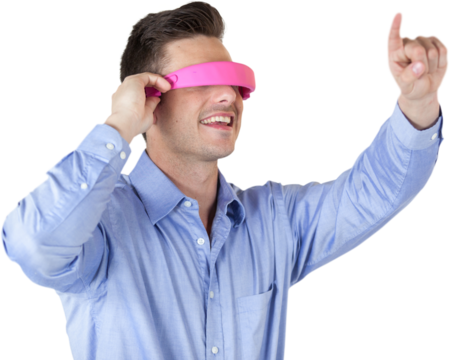 Happy young man gesturing while using virtual reality headset
