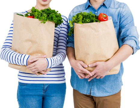 Mid section of couple holding grocery bags - Powered by Adobe