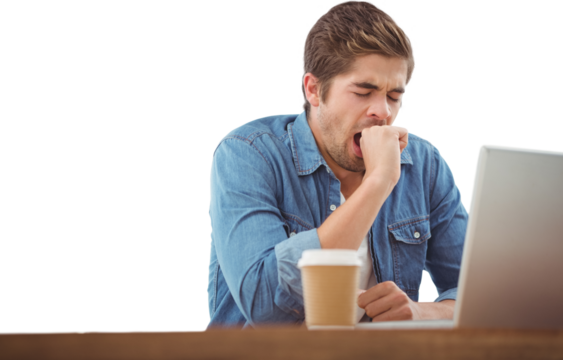 Tired businessman sitting at desk - Powered by Adobe