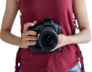 Mid section of woman holding digital camera