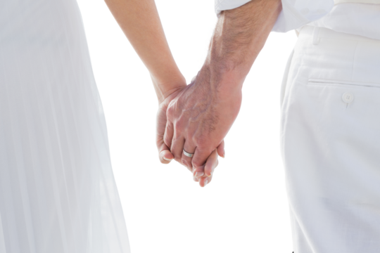 Bride and groom holding hands close up - Powered by Adobe