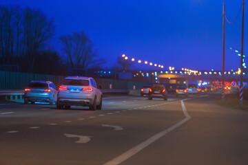 Car traffic in the evening on a suburban highway.