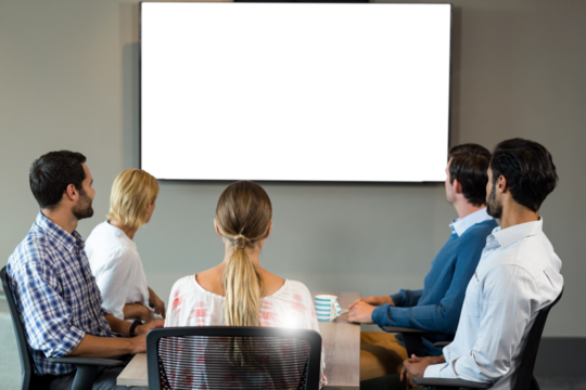Colleagues looking at whiteboard