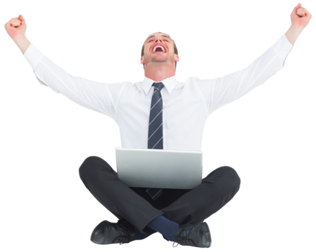 Businessman using laptop and cheering