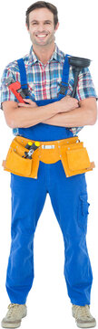 Confident plumber holding monkey wrench and plunger