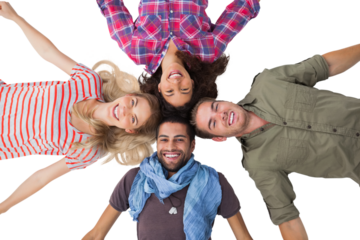 Friends lying in a circle and smiling at camera