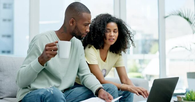 Coffee, laptop and couple with paperwork for finance, taxes or savings on sofa in home. Interracial, documents and black man and woman with computer for planning budget, insurance or financial bills