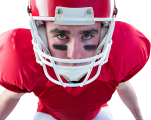 Portrait of a serious american football player taking his helmet looking at camera