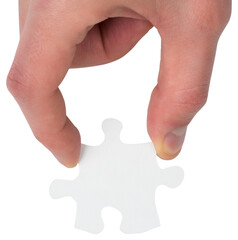 Hand holding jigsaw piece