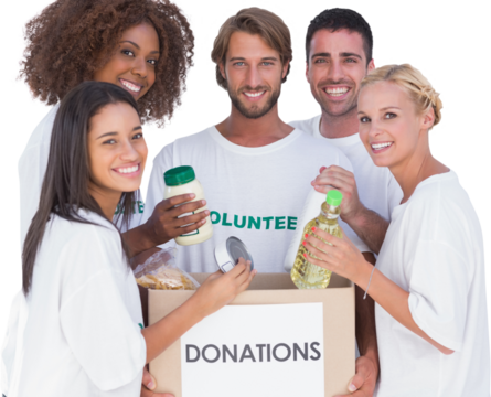 Happy volunteers putting food in donation box