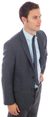 Serious businessman standing with hand on hip