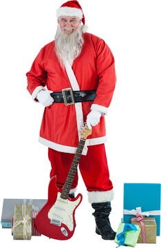 Portrait Santa Claus standing with guitar and gifts