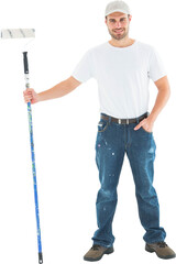 Confident man holding paint roller on white background