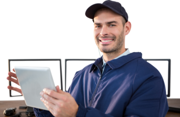 Happy security officer using digital tablet at desk