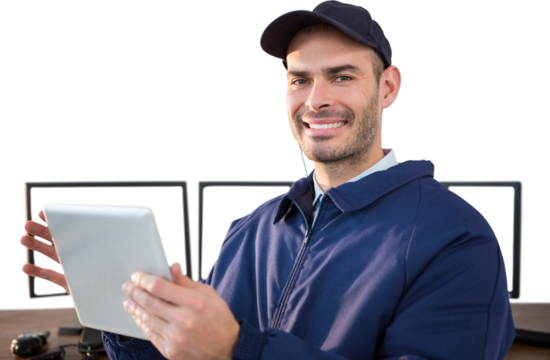 Happy security officer using digital tablet at desk