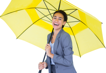 Portrait of happy businesswoman holding umbrella 