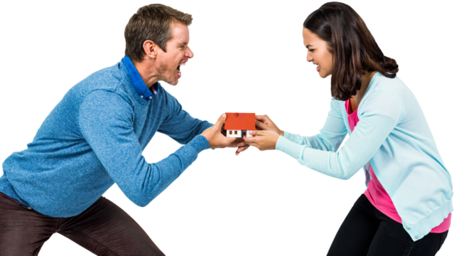 Man and woman holding model house