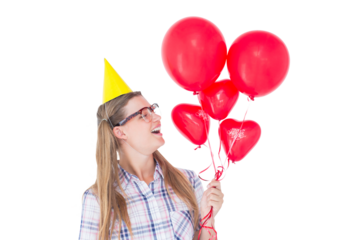 Geeky hipster holding red balloons
