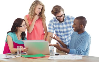 Man gesturing in front of coworkers in creative office